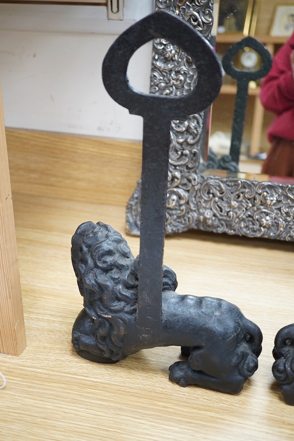 Two cast iron ‘Lion’ door porters, late 19th century, 36.5cm high. Condition - good